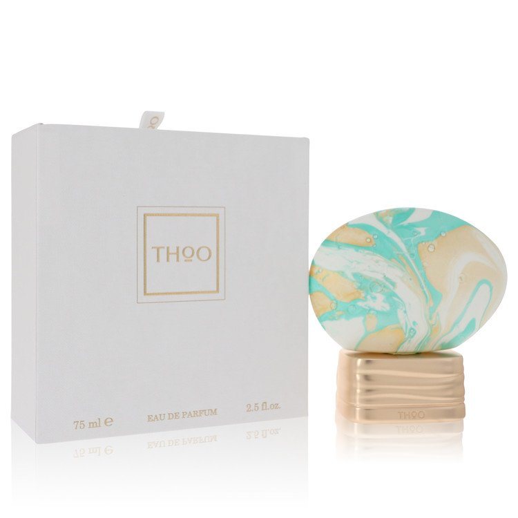 Eau de parfum spray bottle with teal marbled cap and matching product box