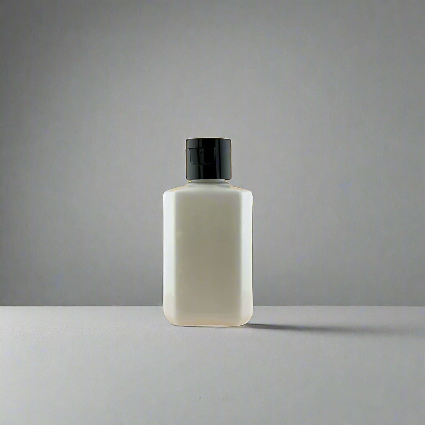 Lotion bottle with black pump dispenser, front-facing bottle view