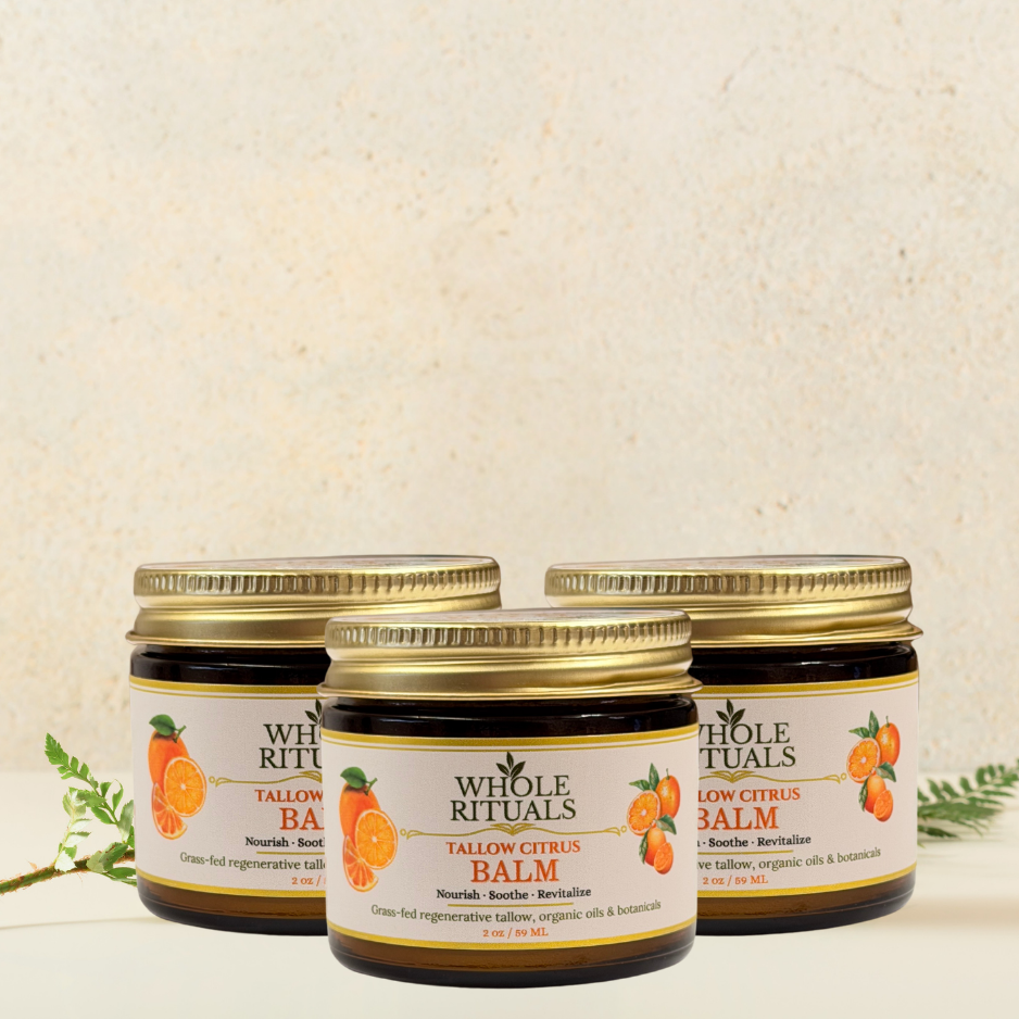 Three tallow citrus balm jars with gold lids, Whole Rituals citrus labels, clustered view