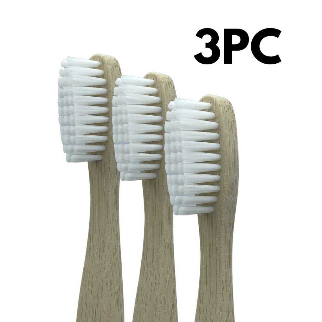 Three bamboo toothbrushes with light wood handles and white bristle heads
