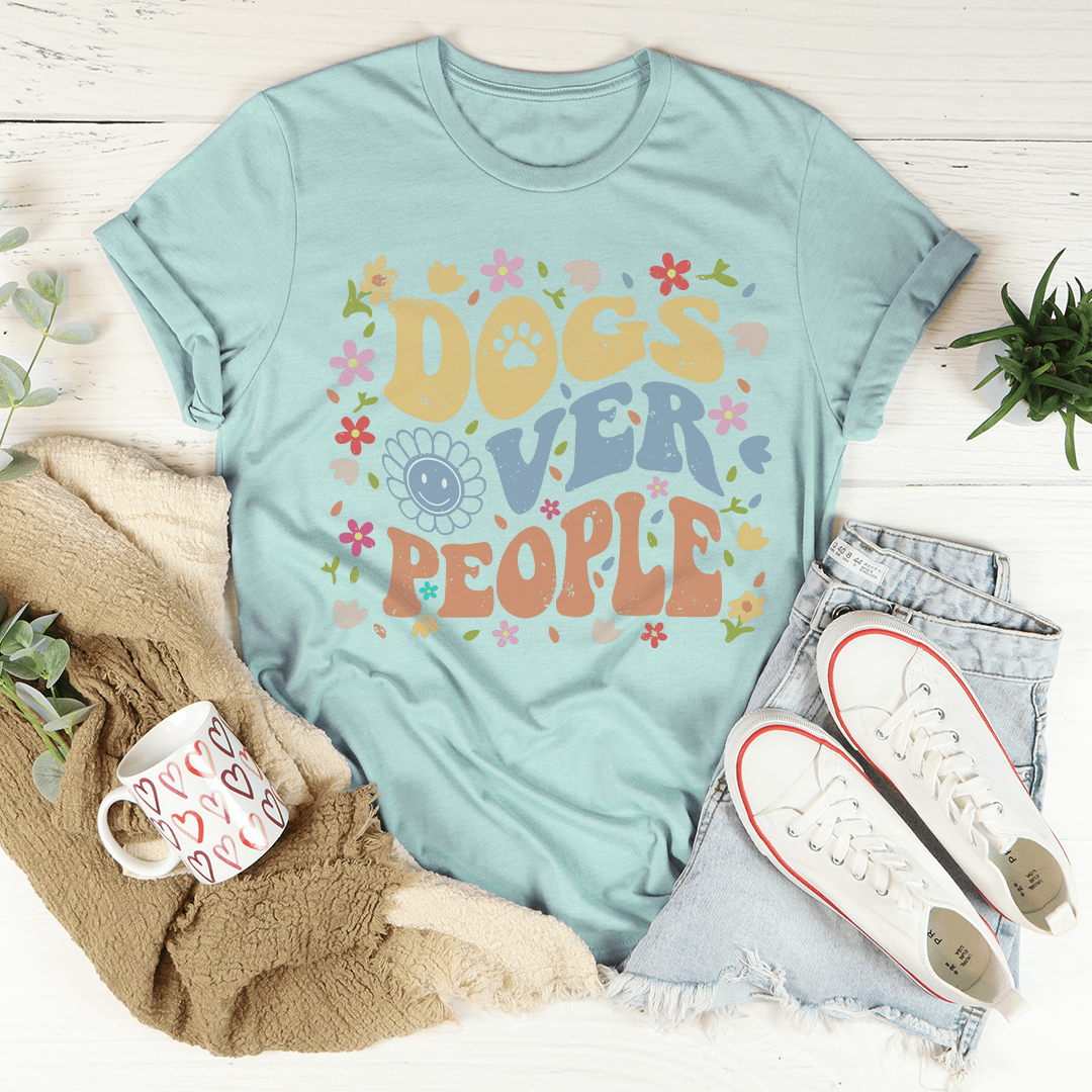 Dusty blue crew-neck T-shirt with colorful Dogs over People paw print graphic.
