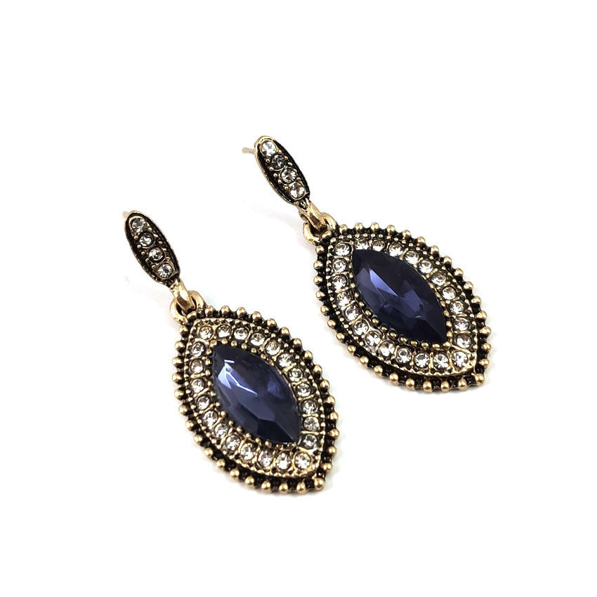 Pair of gold-tone oval drop earrings with blue center stones and clear rhinestones