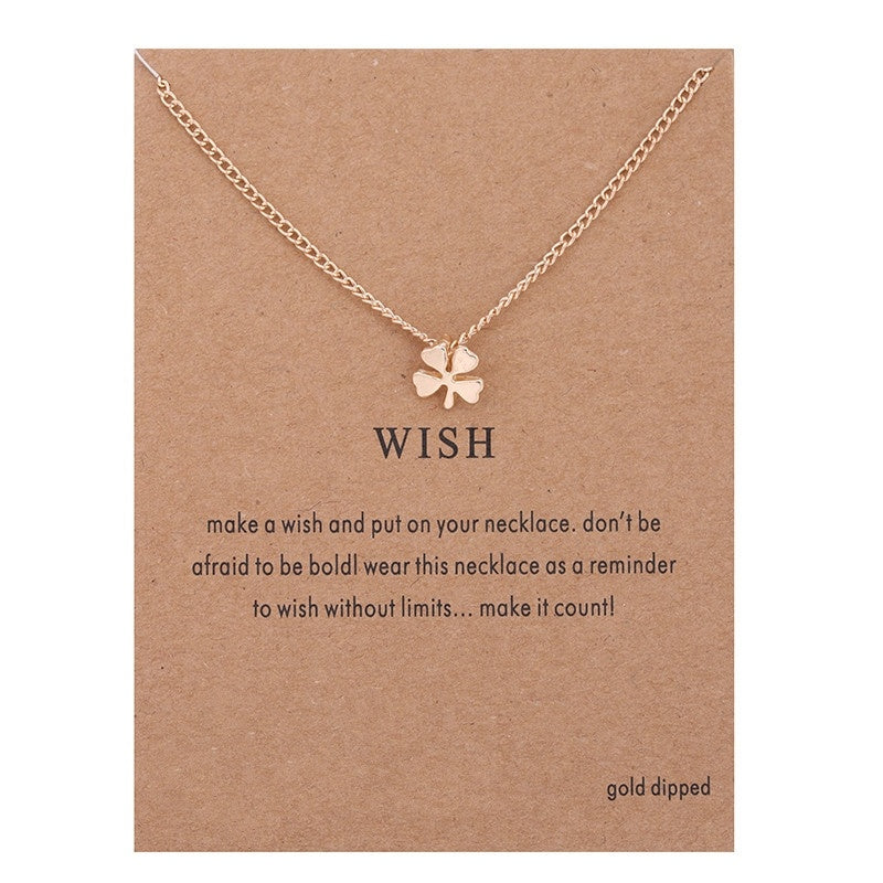 Gold-toned necklace chain with small four-leaf clover pendant