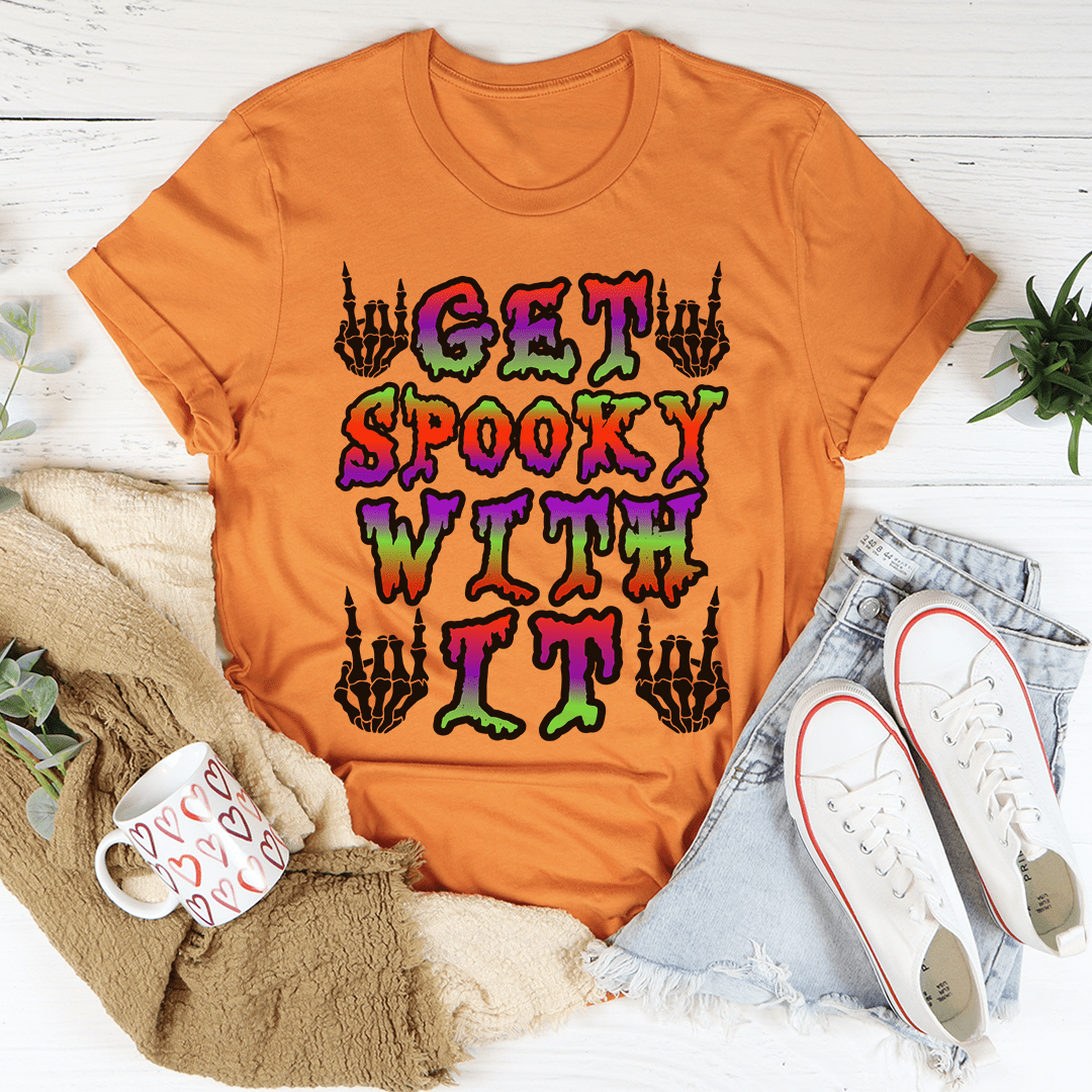 Orange crew-neck T-shirt with multicolor spooky lettering and hands graphic