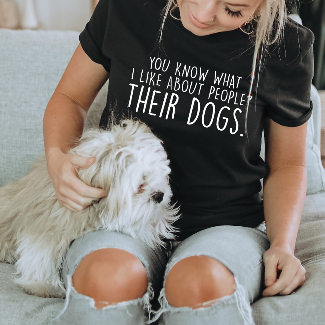Black crewneck T-shirt with white slogan text: 'You know what I like... Their dogs.'