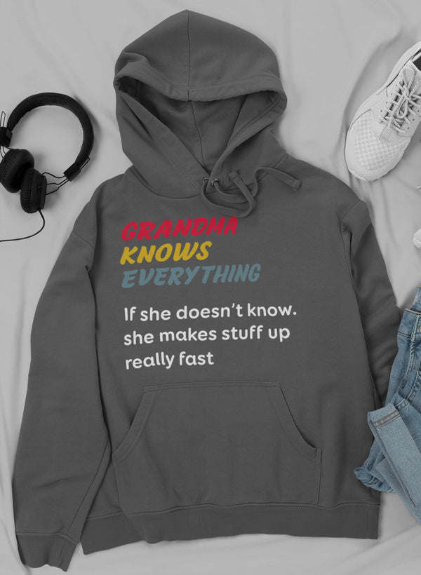 Dark gray hoodie with drawstring hood, kangaroo pocket, and “GRANDMA KNOWS EVERYTHING” front print