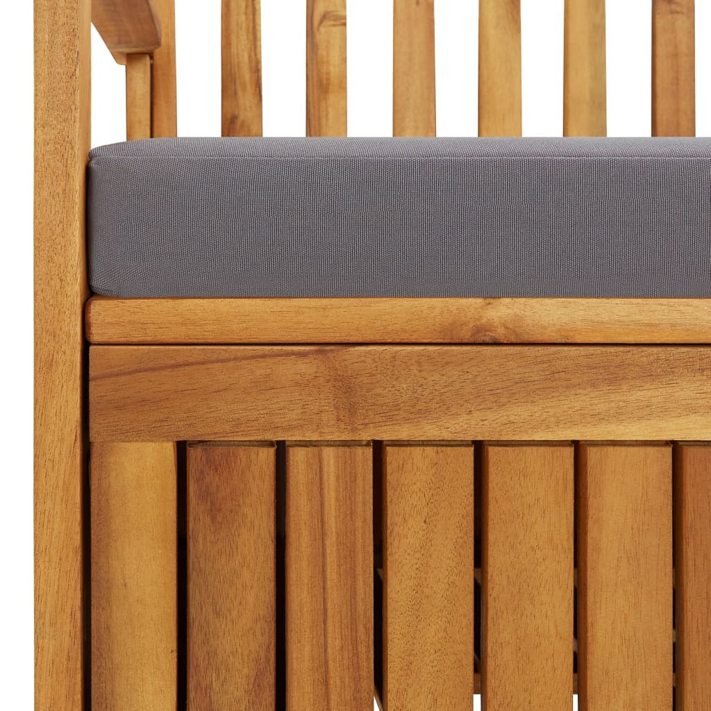 Acacia wood storage bench close-up: gray cushion edge and slatted cabinet panel