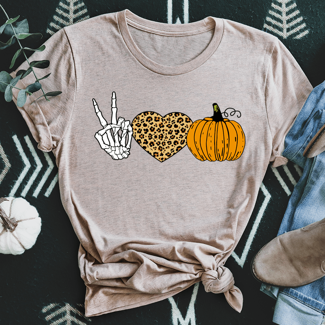 Heather taupe Halloween graphic t-shirt with peace hand, leopard heart, orange pumpkin and knotted front