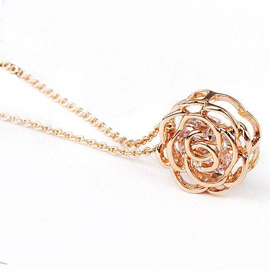 Rose pendant necklace with rose-motif pendant and clear accent stones on chain