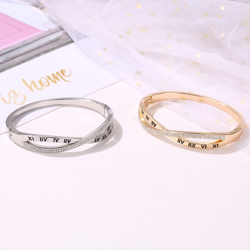 Roman numeral bracelet bangles, silver and gold tones with rhinestone accents