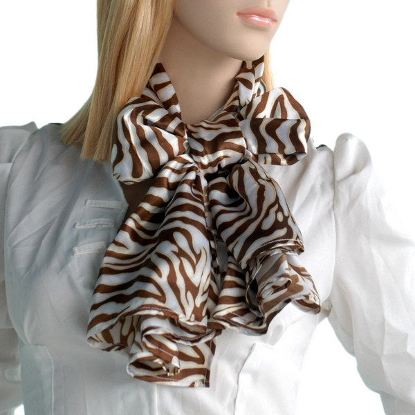 Silk zebra-print scarf tied at the neck over a white top