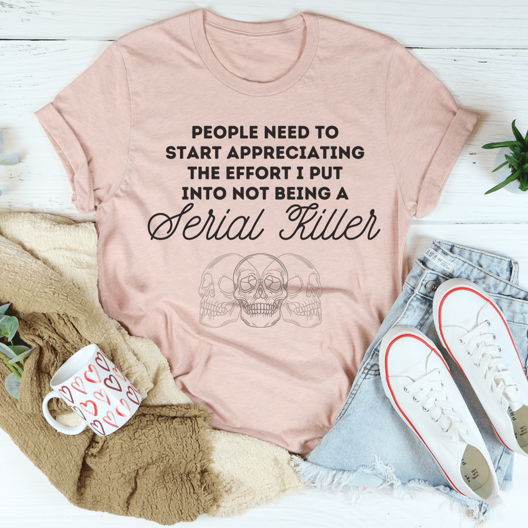 Blush pink crewneck T-shirt with 'Serial Killer' script and skull line art