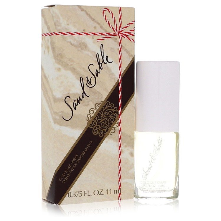 Sand & Sable by Coty cologne spray bottle with cream label, shown with gift box.