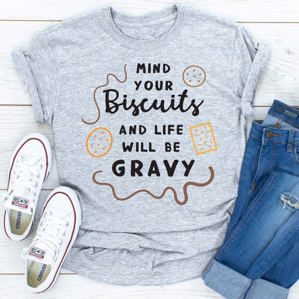 Heather grey crewneck T-shirt with biscuit-and-gravy wording in brown and orange print.