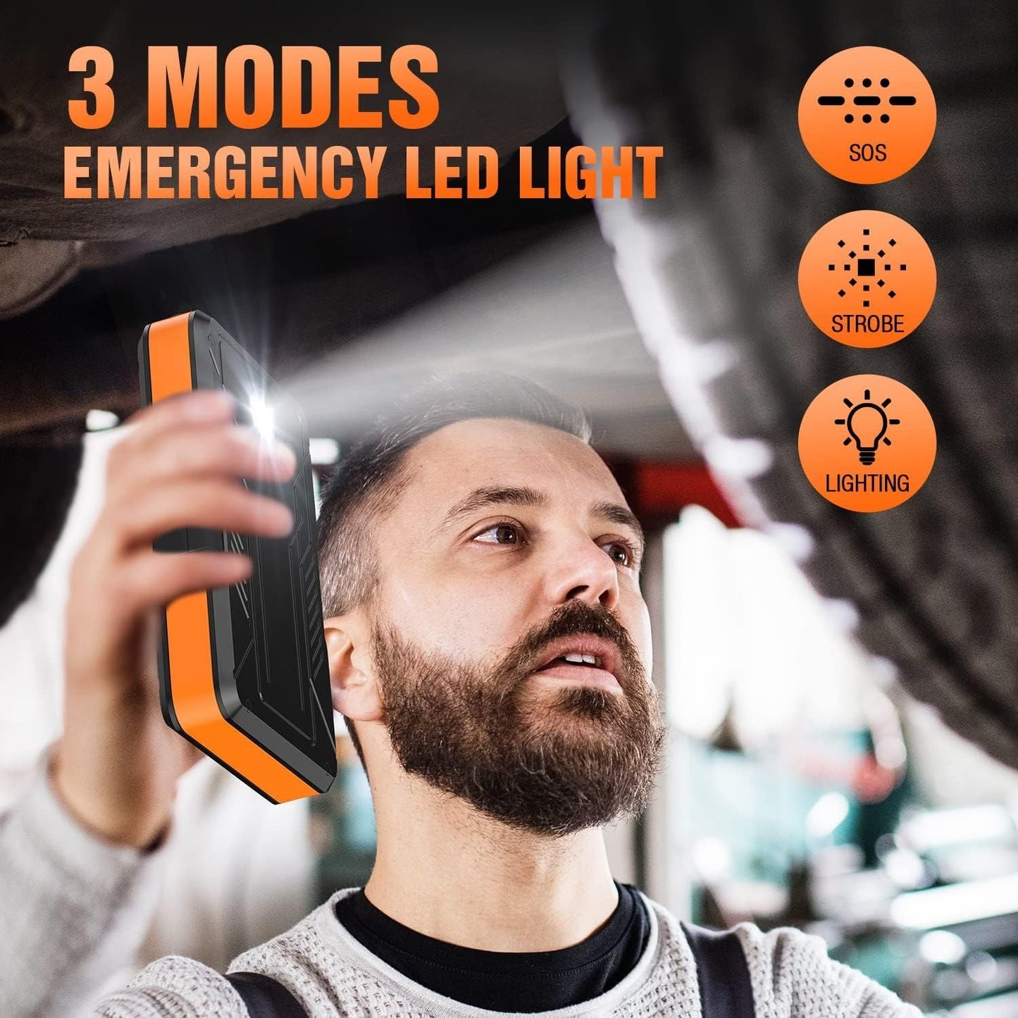 Handheld jump starter with flashing LED light held near a person