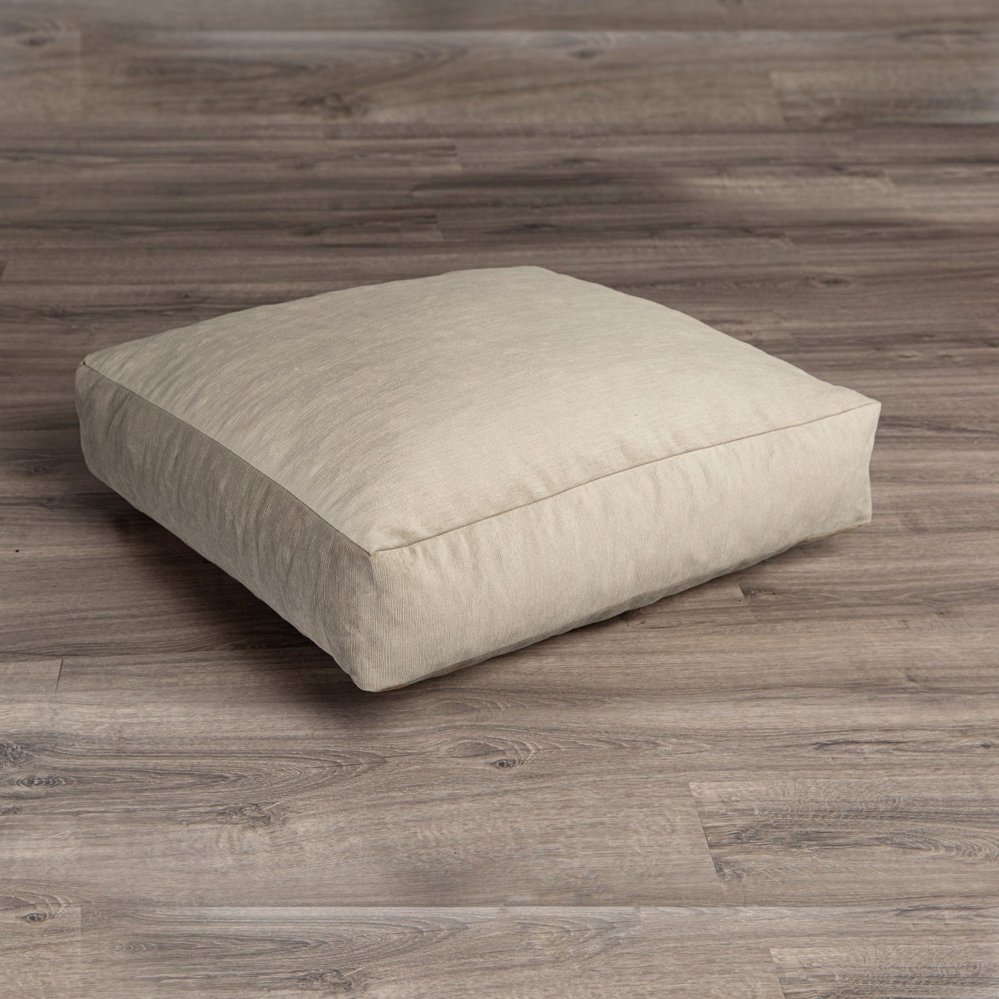 Ivory plush microvelvet floor cushion, low rectangular pillow on wood floor
