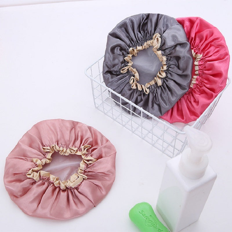 Set of satin shower caps: pink, red, and gray with ruffled elastic edges