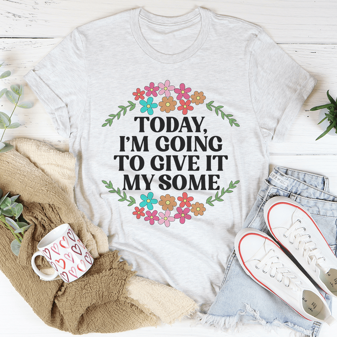 Light gray crewneck T-shirt with floral wreath graphic and slogan 'TODAY, I'M GOING TO GIVE IT'