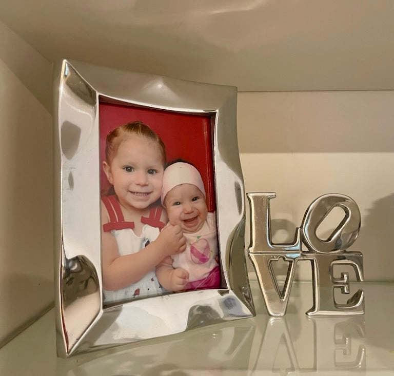 Silver picture frame with red photo mat and decorative LOVE letters