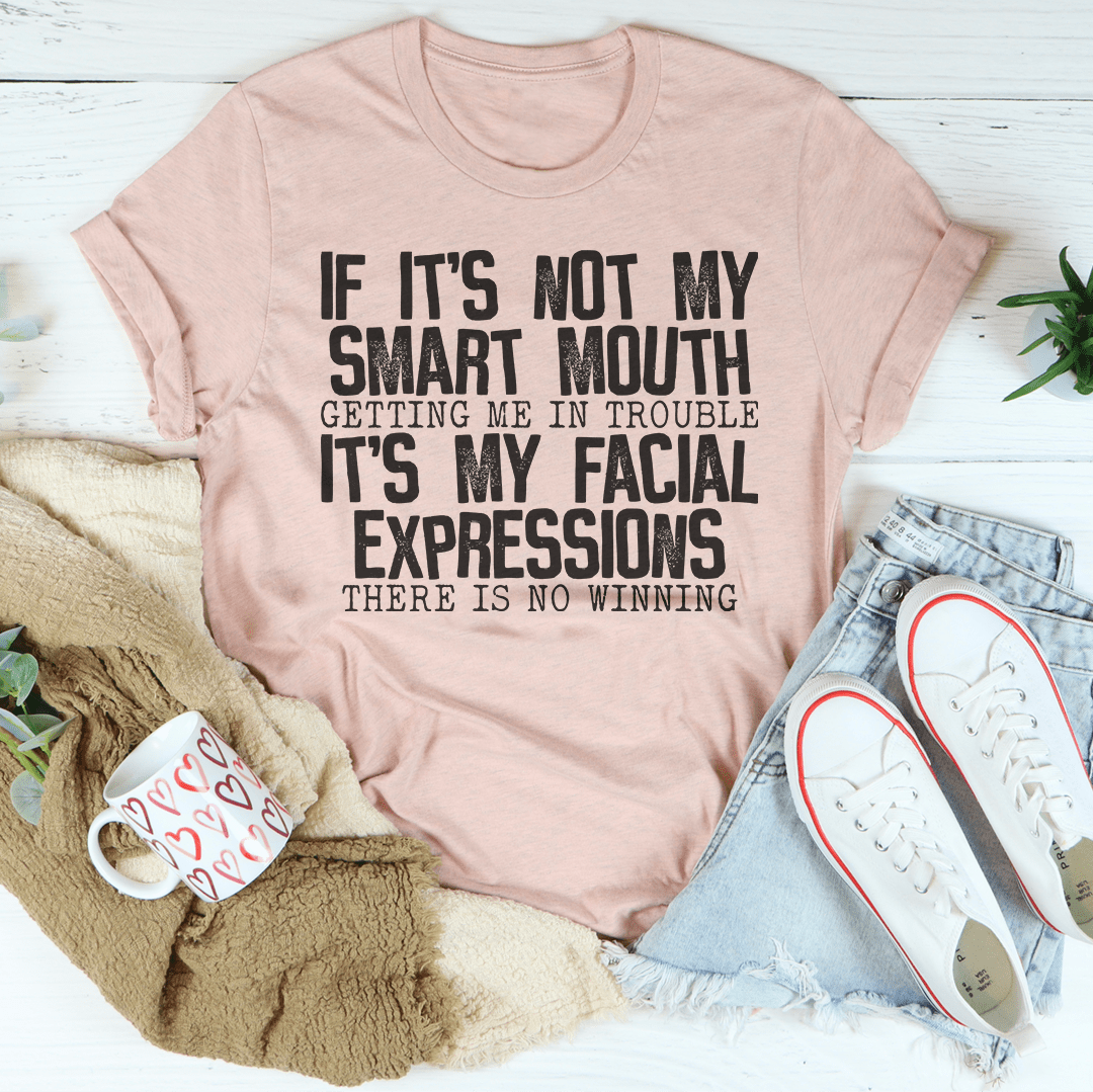 Mauve crewneck T-shirt with bold stacked facial expressions wording