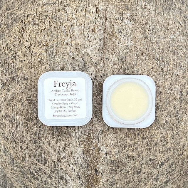 Freyja scented balm jar with square lid and pale yellow cream inside