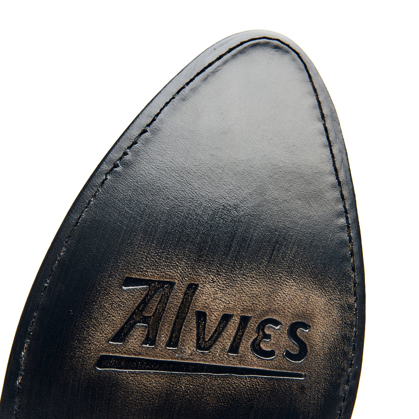 Black leather boot interior with stitched edge and embossed logo