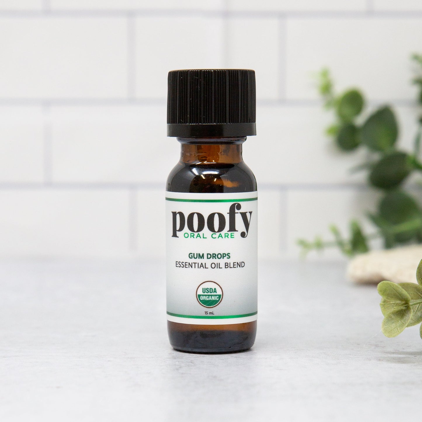 poofy Oral Care gum drops essential oil blend bottle, amber glass with black cap