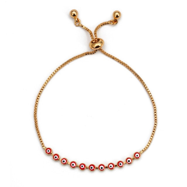 Charm bracelet with gold cord and red-and-blue evil-eye bead row