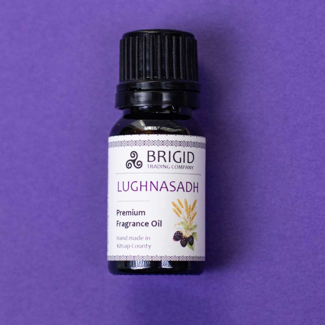 Diffuser fragrance oil bottle with black cap and label reading LUGHNASADH