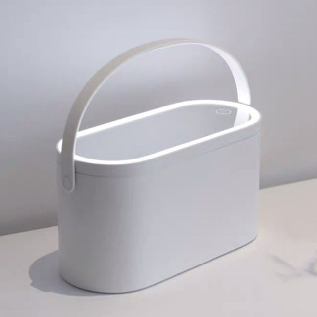 White makeup organizer box with curved handle and minimal design, covered top