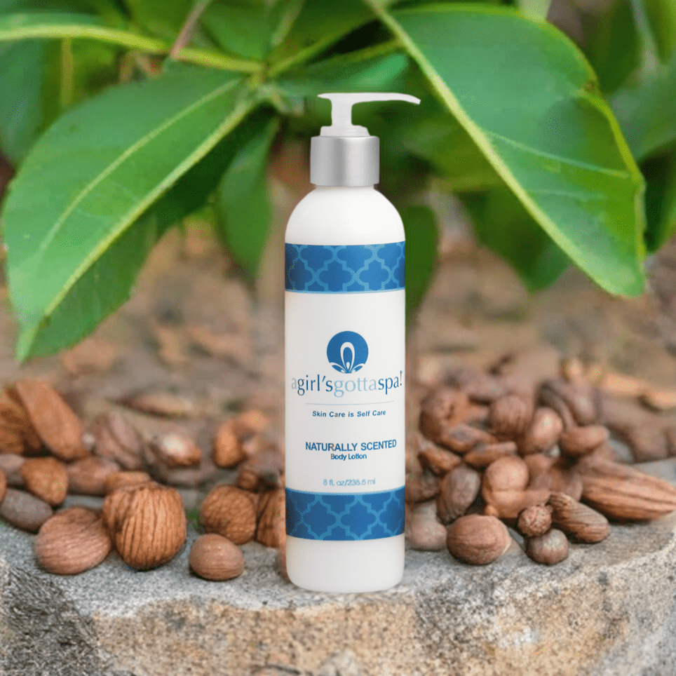 Body lotion bottle with silver pump and blue patterned label, full bottle