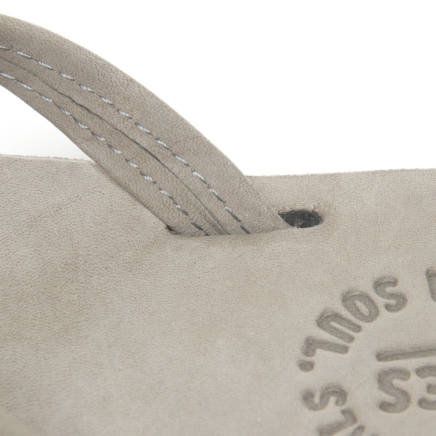 Thong strap with stitch detail; tan footbed with Austin logo.