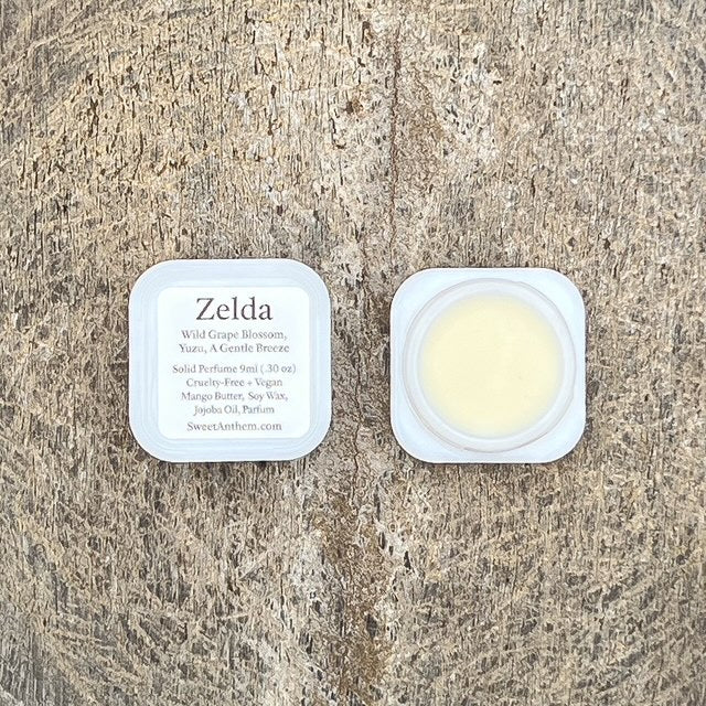 Zelda solid perfume jar with creamy balm in white plastic container
