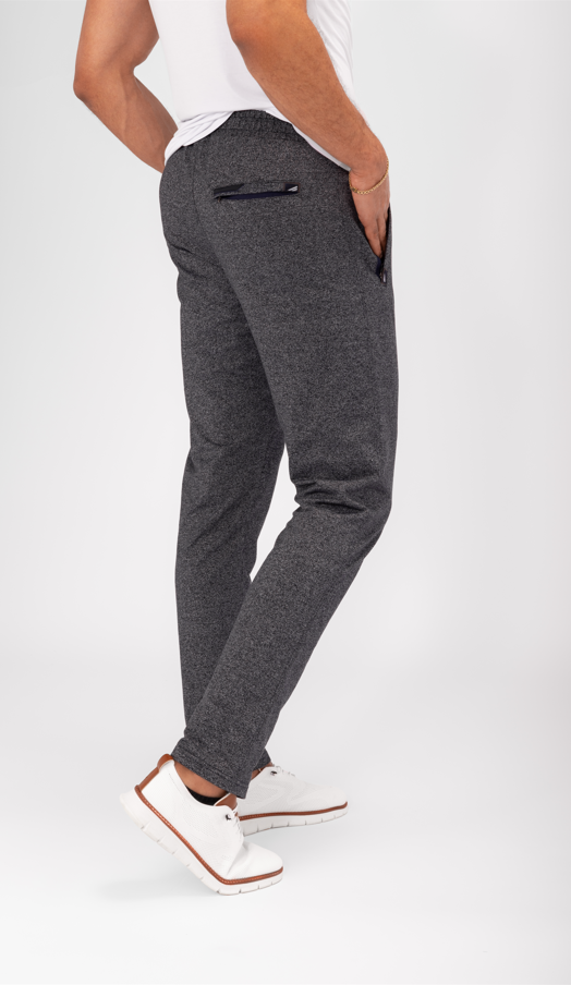 Tapered athletic sweatpants in dark charcoal gray, slim tapered leg, cuffed hem, side pocket.