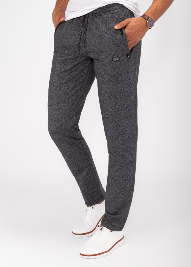 Tapered athletic sweatpants in dark charcoal gray, elastic waistband, cuffed ankle, side pockets.