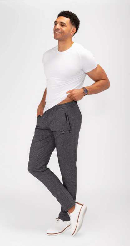Athletic sweatpants with tapered legs, elastic waistband, and drawstring; dark heather grey.