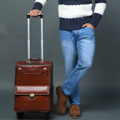 Brown leather carry-on trolley bag with telescoping handle and front latch detail