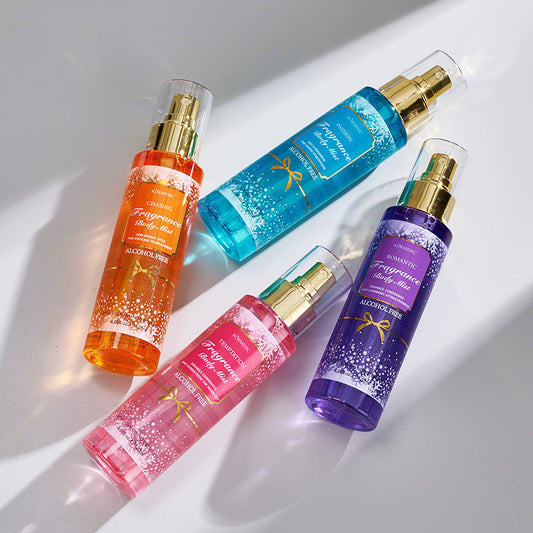 Fragrance body care set bottles and sprays in blue, orange, pink, and purple