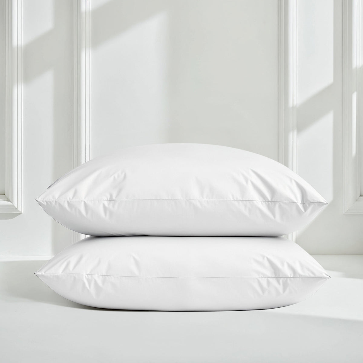 White sateen pillowcase set with two stacked pillows and smooth finish