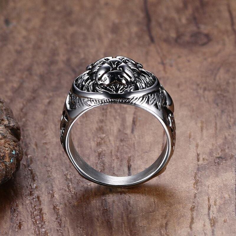 Lion head ring, silver-tone metal, side view of band with raised lion head