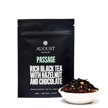 Rich black tea blend pouch with a small bowl of loose tea beside it