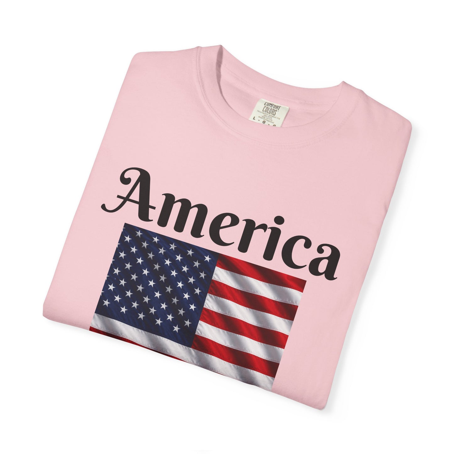 Light pink T-shirt with America script above a red, white, and blue flag graphic