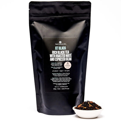 Black tea blend pouch with back label and small bowl of loose tea in front
