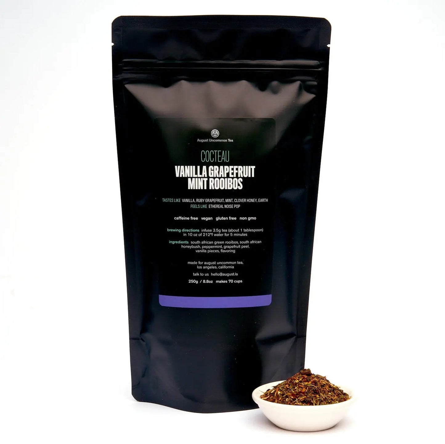 Caffeine-free vanilla grapefruit mint rooibos tea bag with dish of loose tea
