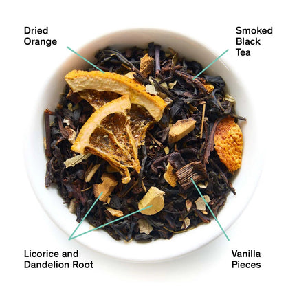 Loose black tea blend with orange slices, vanilla pieces, and dandelion root in a bowl