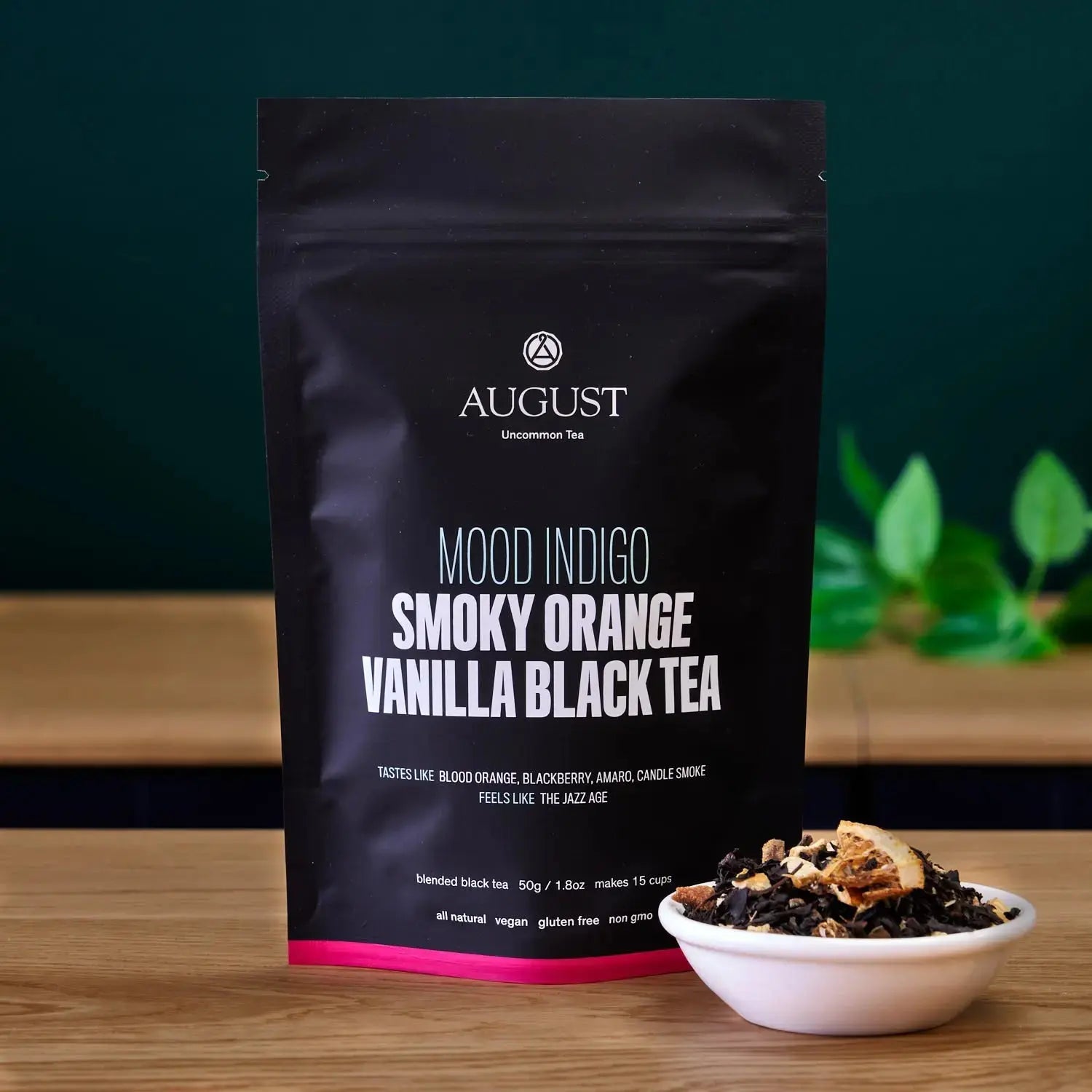 Smoky Orange Vanilla Black tea bag standing with bowl of loose tea beside it