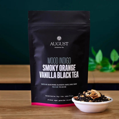 Smoky Orange Vanilla Black tea bag standing with bowl of loose tea beside it