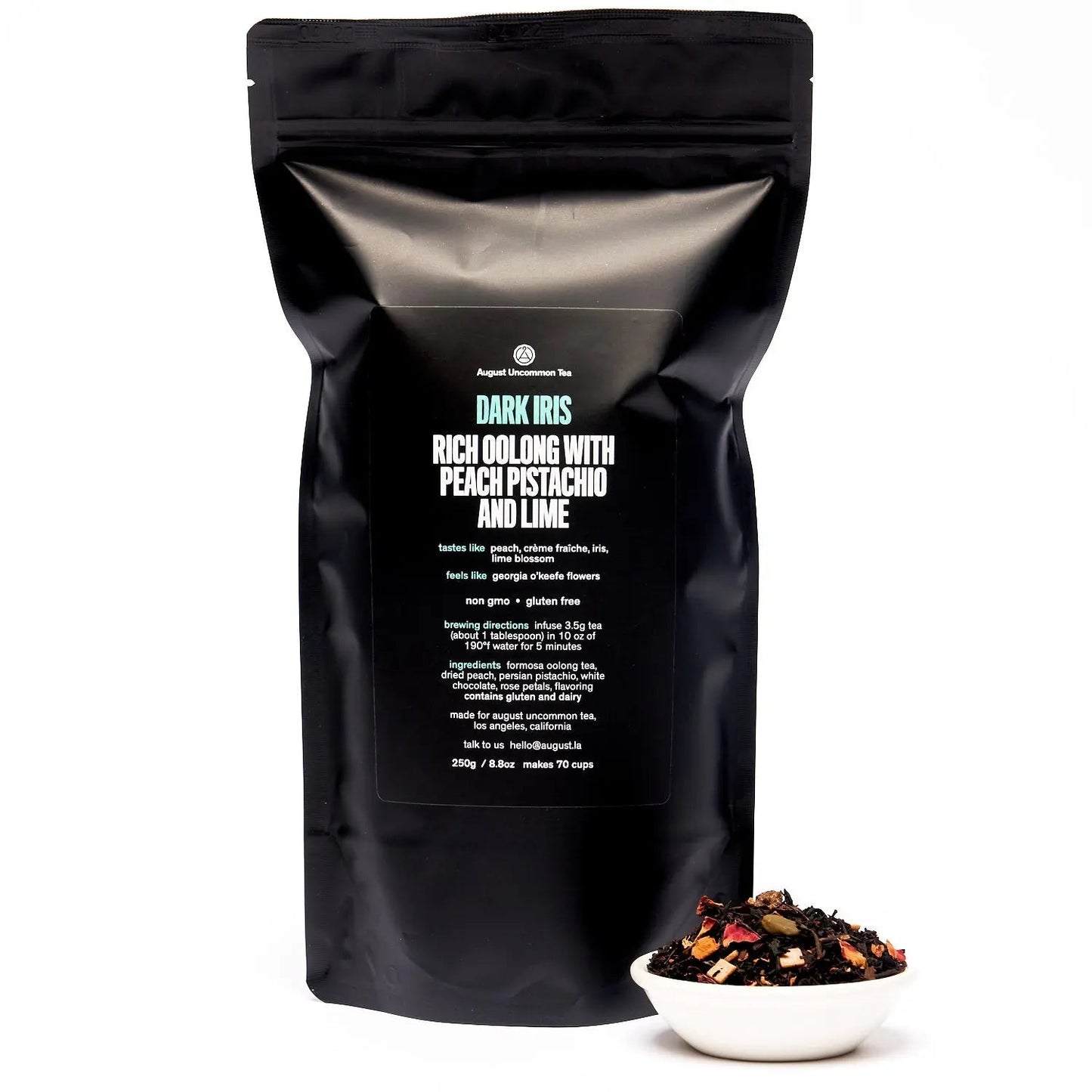 Dark tea pouch back side with nutrition and brewing information; small sample in bowl