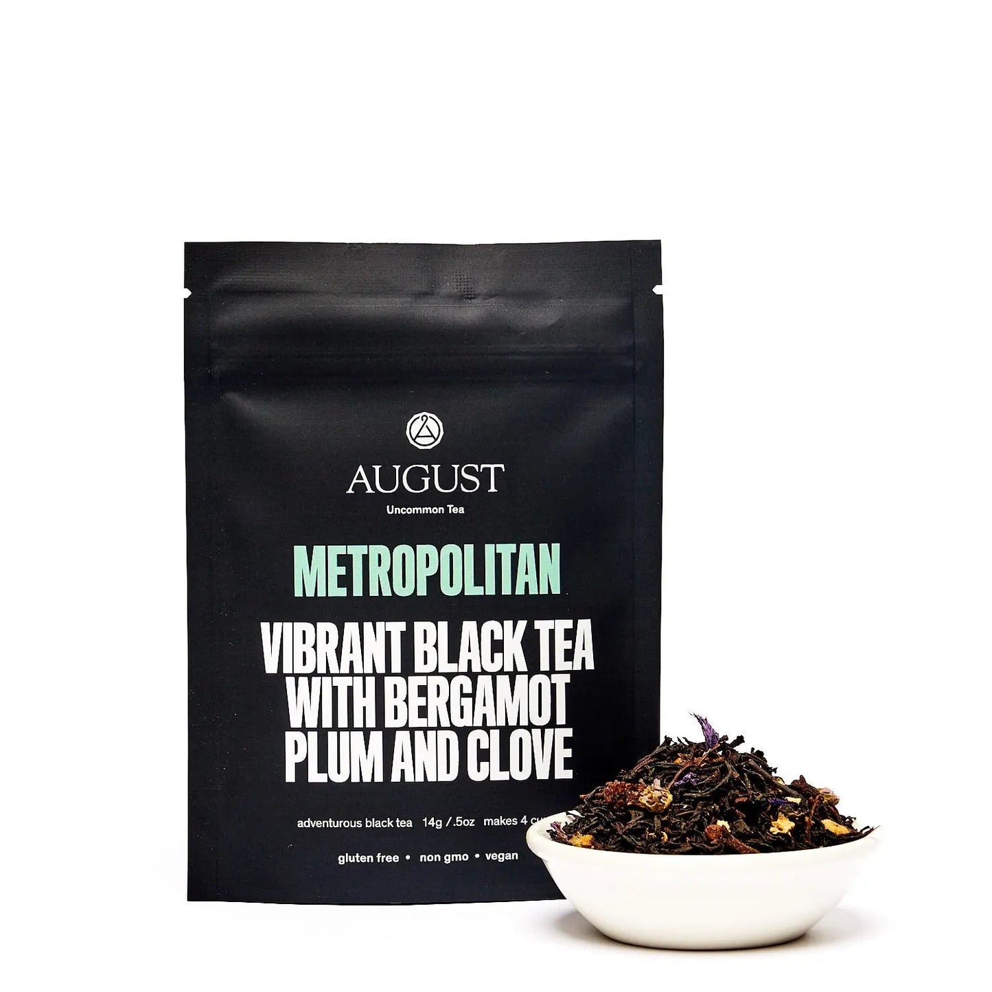 Black Metropolitan black tea pouch with tea leaves in a small white bowl