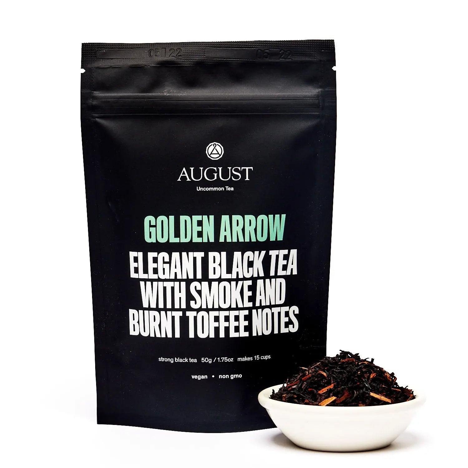 Golden Arrow black tea pouch with smoky flavor, beside a bowl of leaves